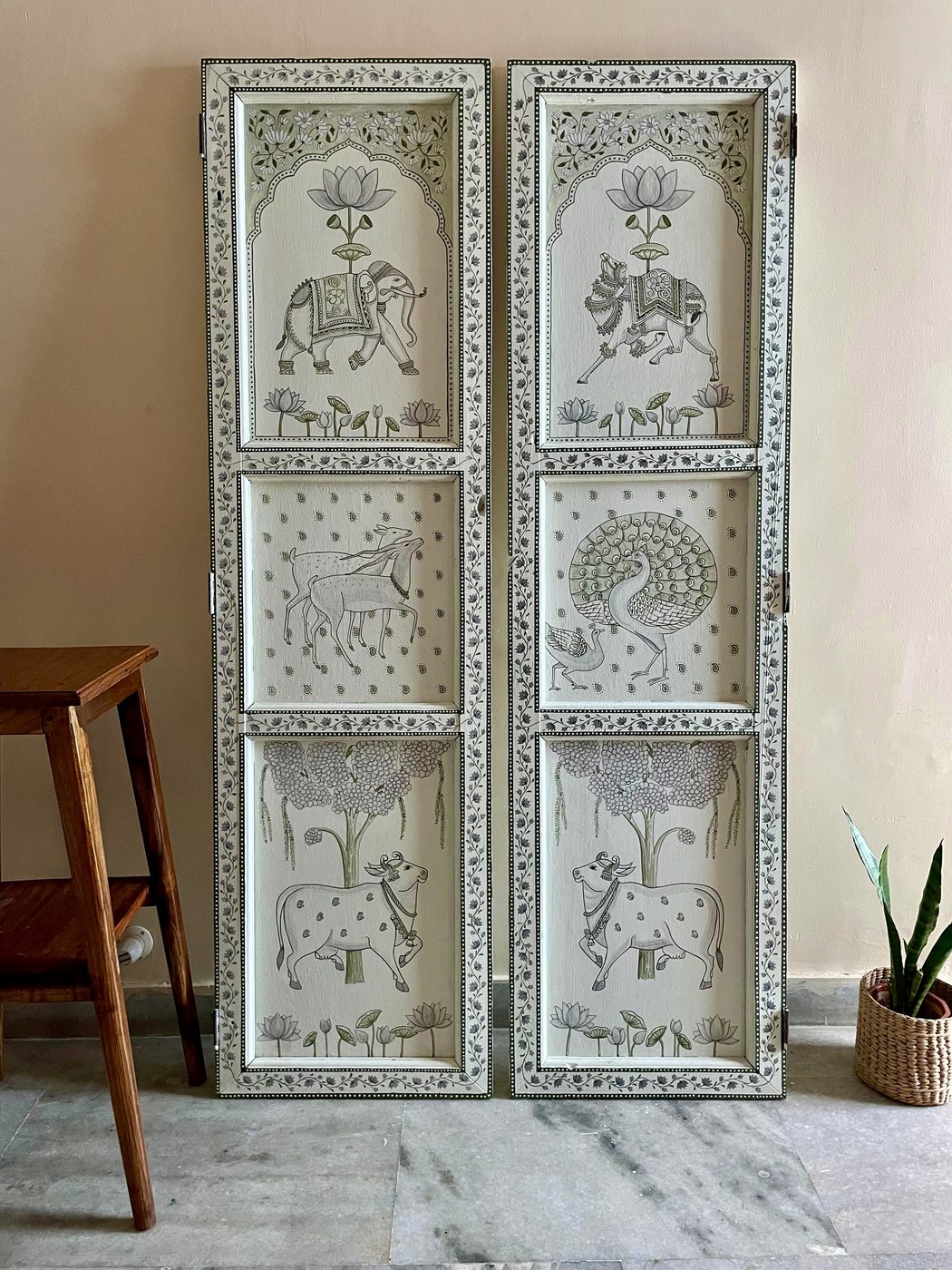 Carved decorative panels with elephants and peacocks