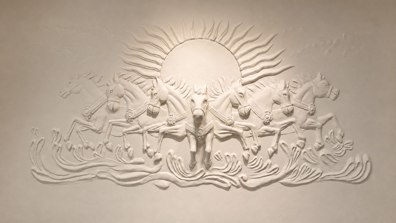 Seven horses hand-sculpted as a wall relief